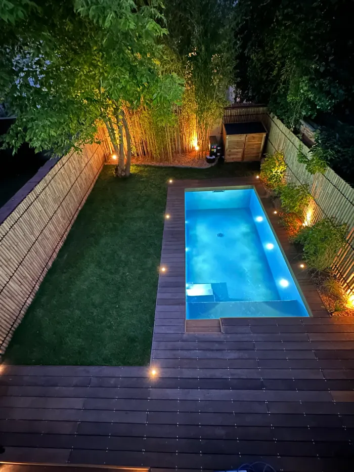 Landscaped urban garden, exotic timber decking and planting around the pool