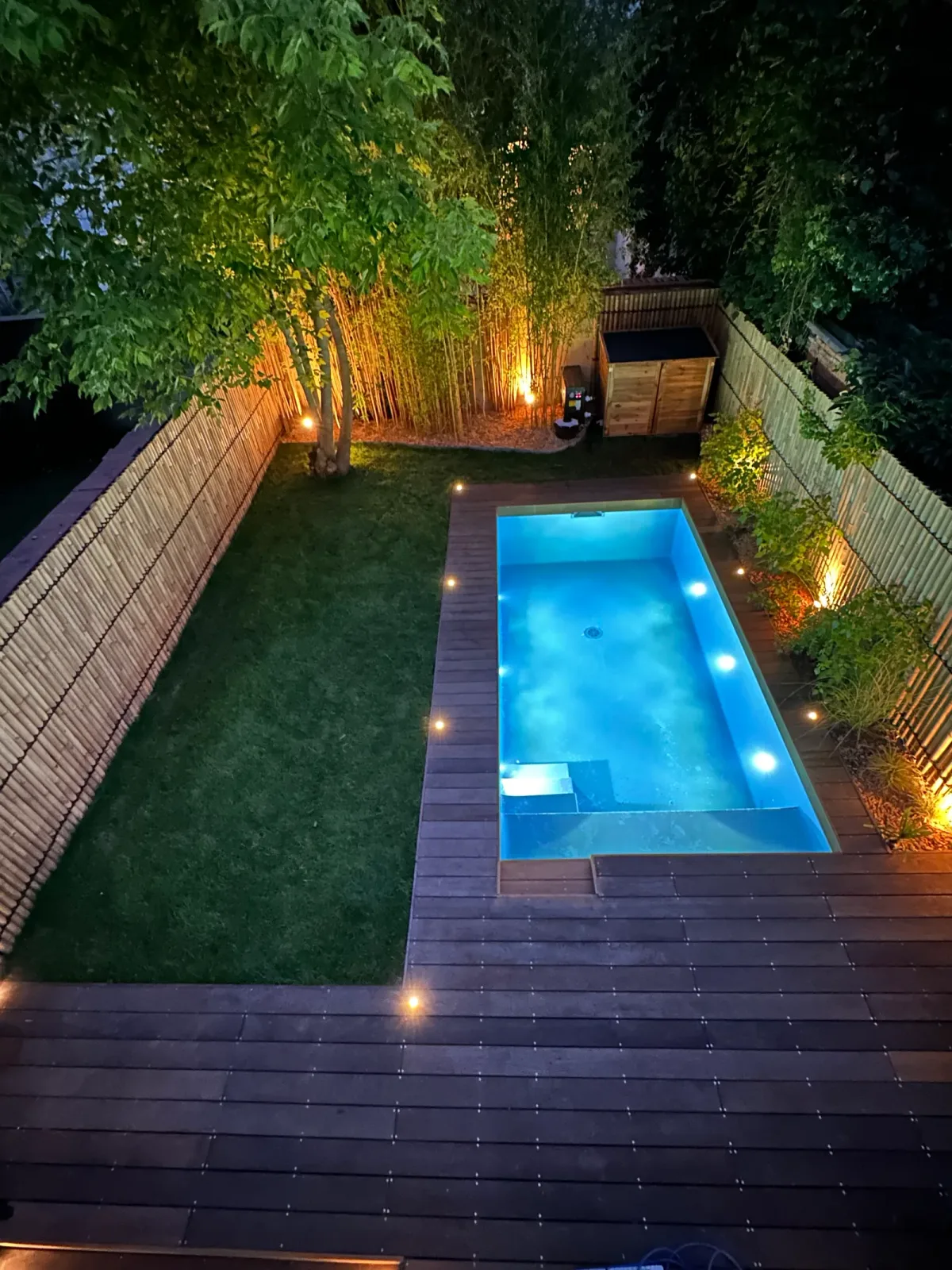 Landscaped urban garden, exotic timber decking and planting around the pool